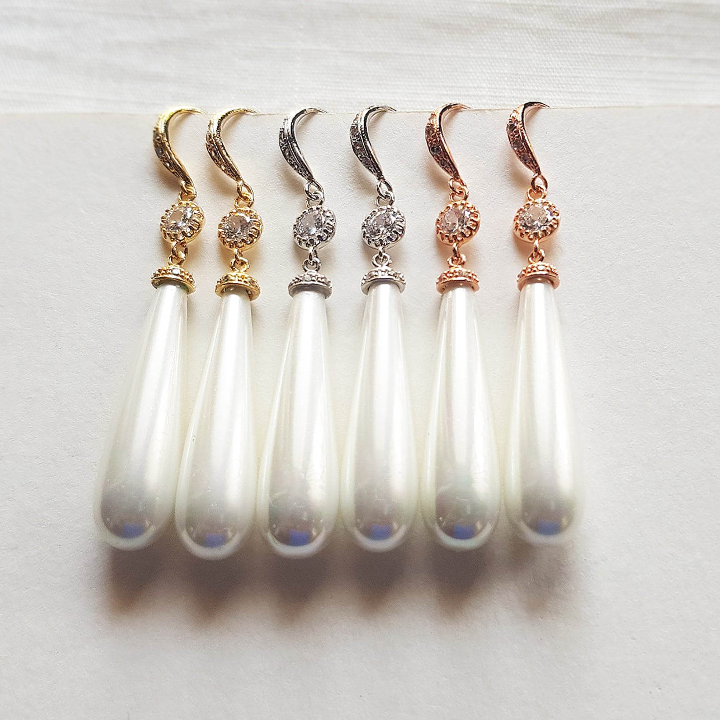 Long dangle pearl earrings in gold, silver and rose gold